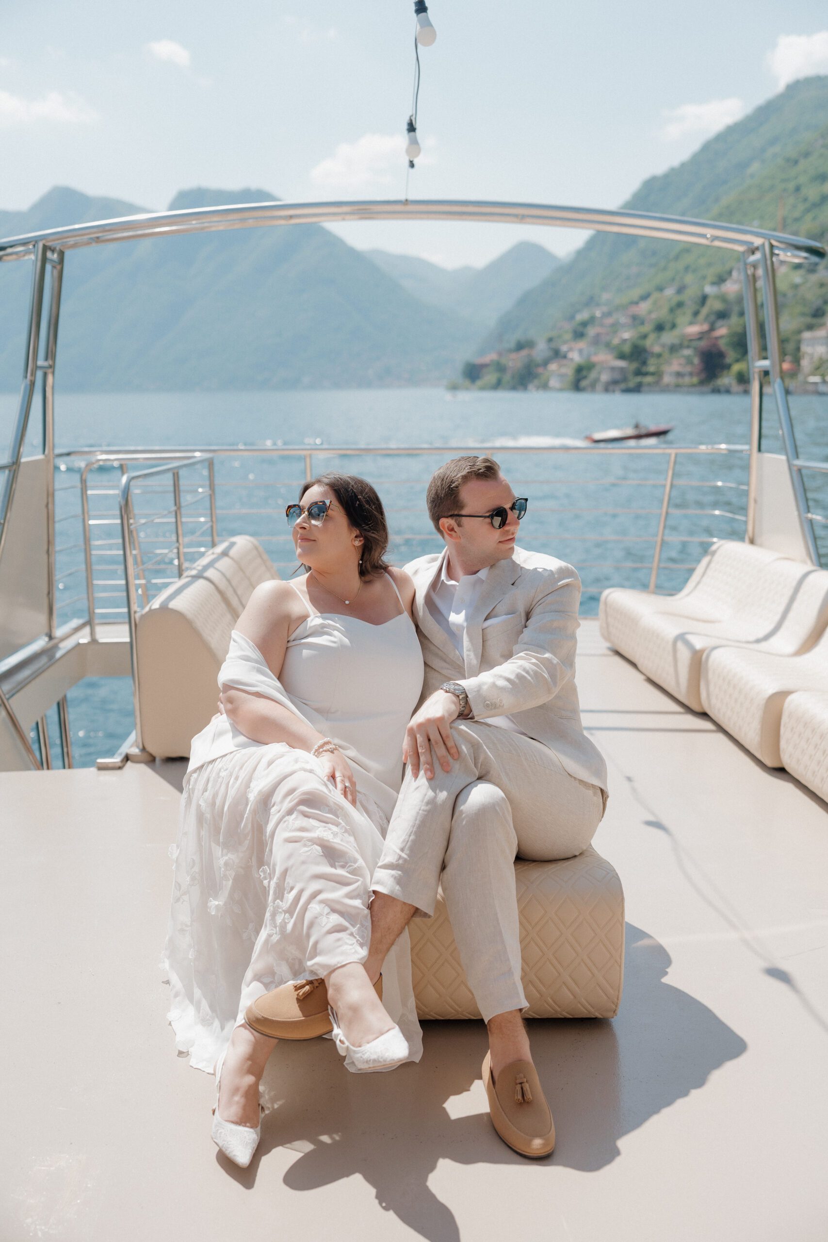 Elegant boat on Lake Como with guests enjoying pre-wedding celebration.