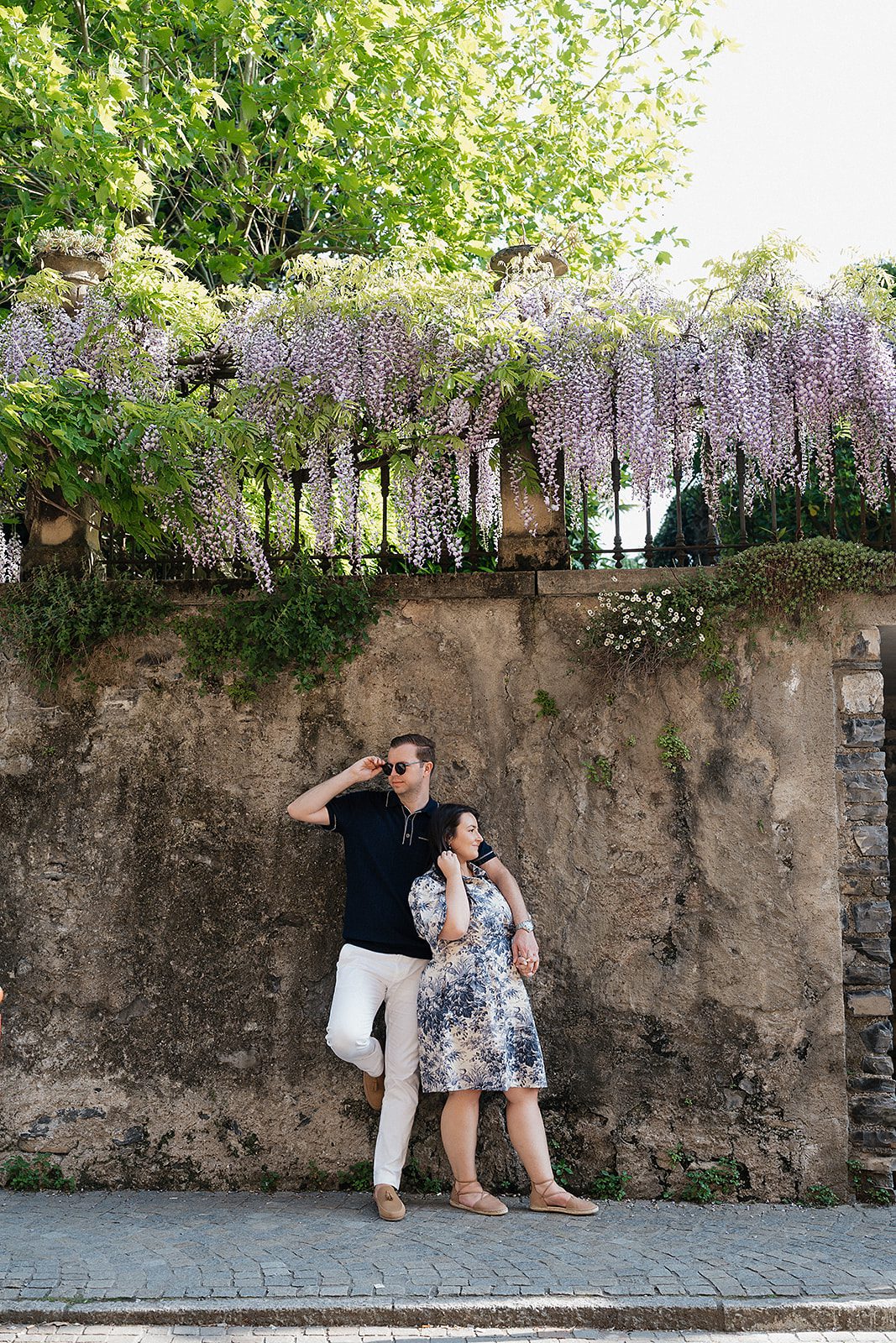 Romantic moment captured as the couple enjoys a spritz in a quiet piazza in Bellagio.capt