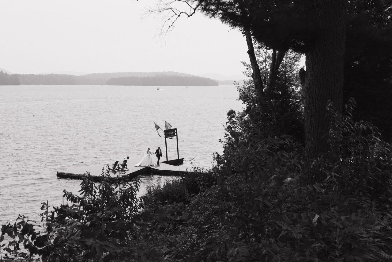 Bride and groom at their rustic-elegant lakeside wedding at Great Pines Resort in Old Forge, NY