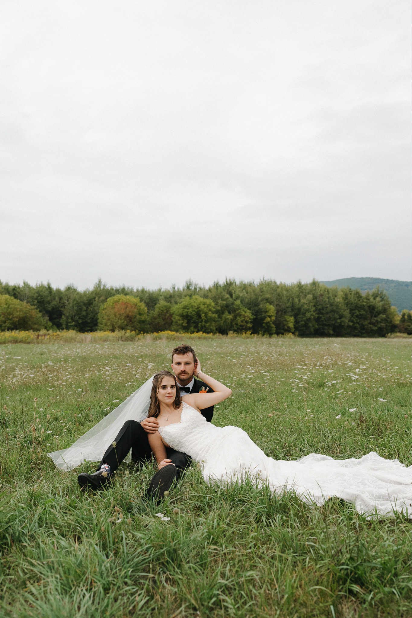 Bride and groom at Parish Hill Event Barn during their fall wedding in Central New York, surrounded by rustic decor and burnt orange tones.