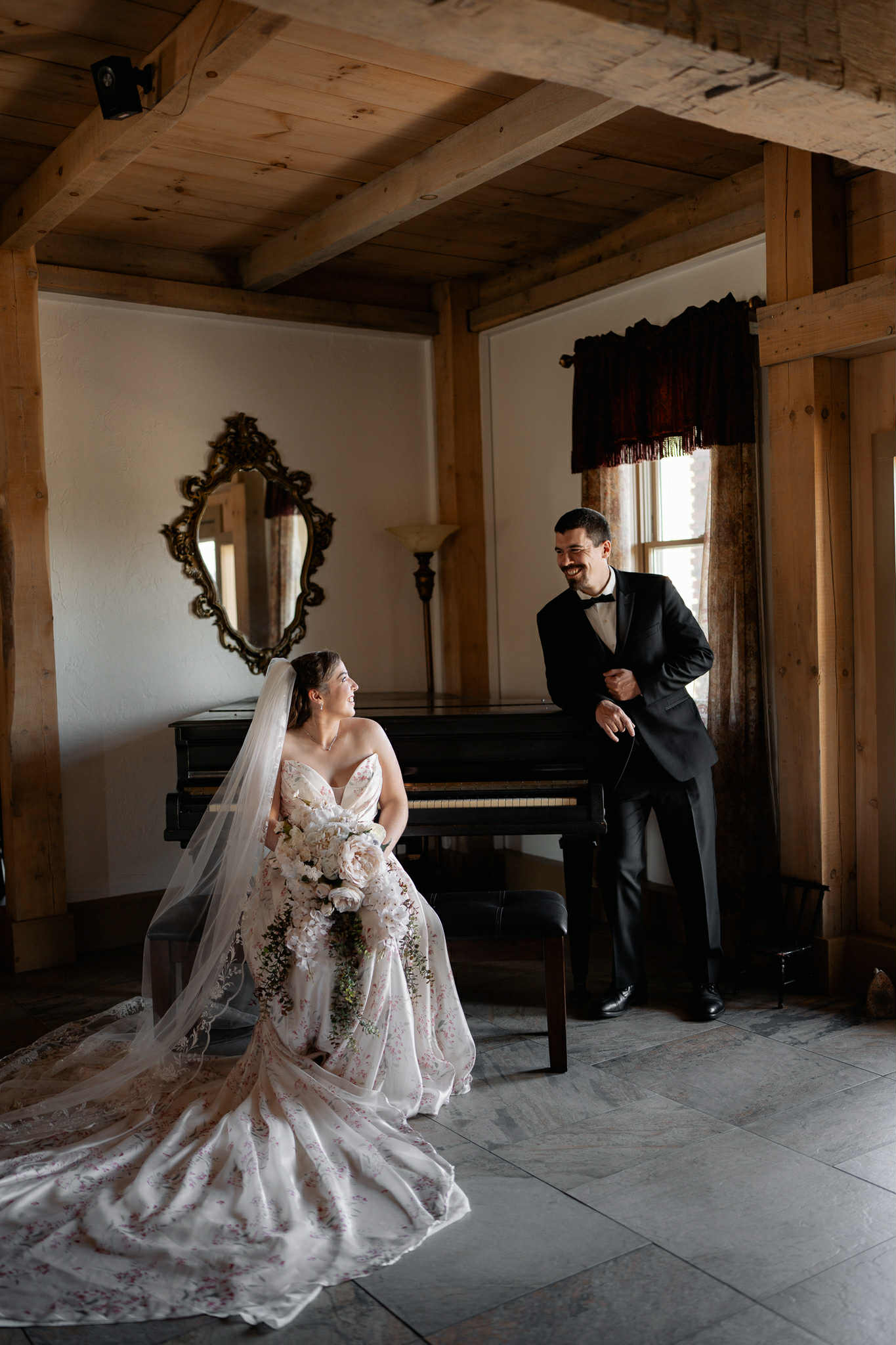 Bride and groom sharing a romantic moment by the lake at Chantelle Marie Lakehouse in Auburn NY on their warm October wedding day.